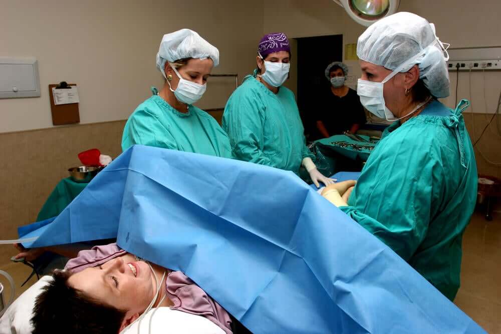A woman having a Cesarean section.