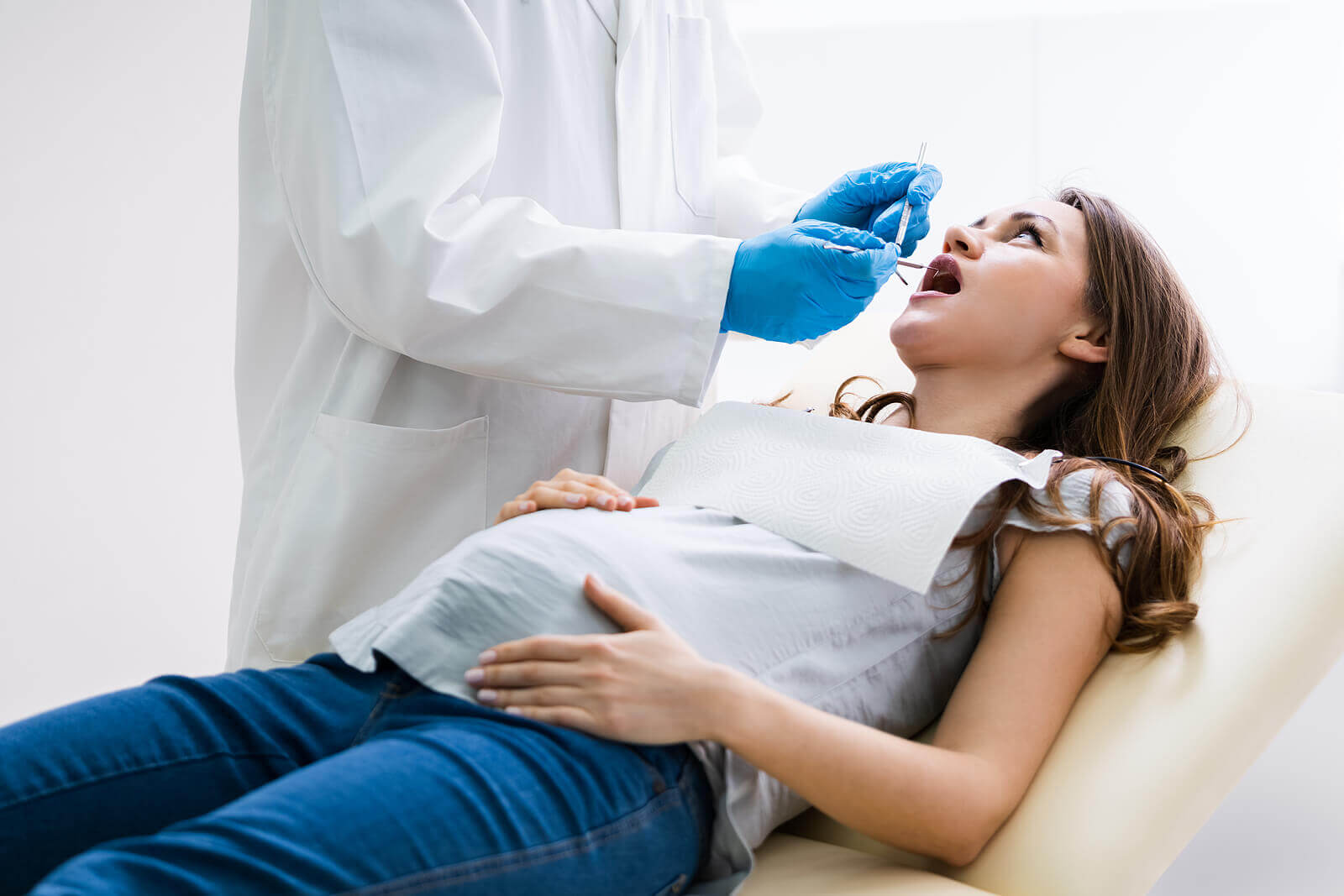 A pregnant woman at the dentist.