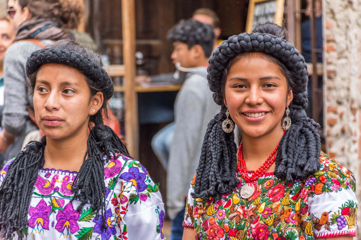 Two Mayan women in traditional dress.
