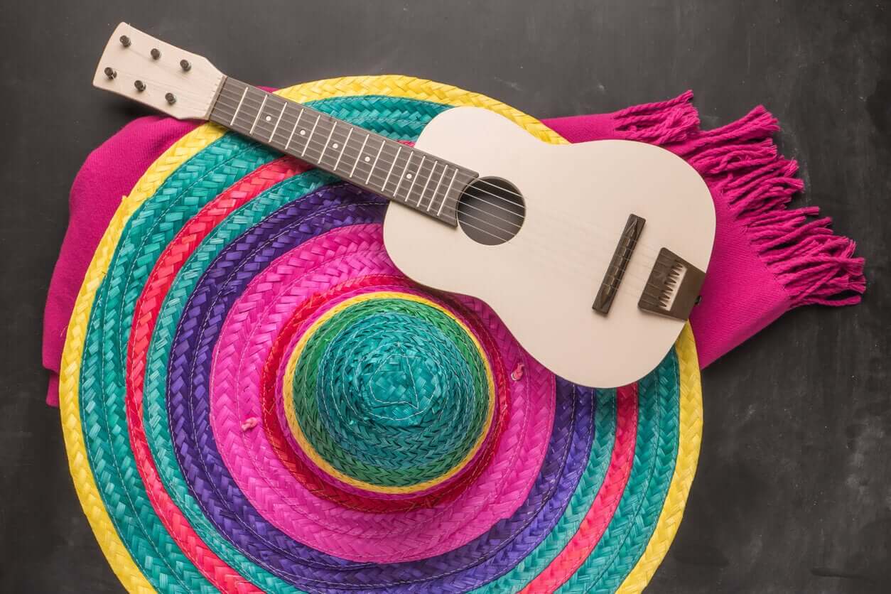 A colorful woven hat and a guitar.