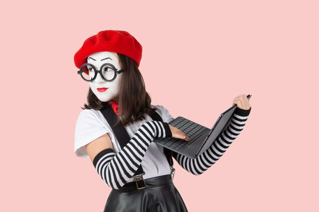 A young girl dressed up as a mime.