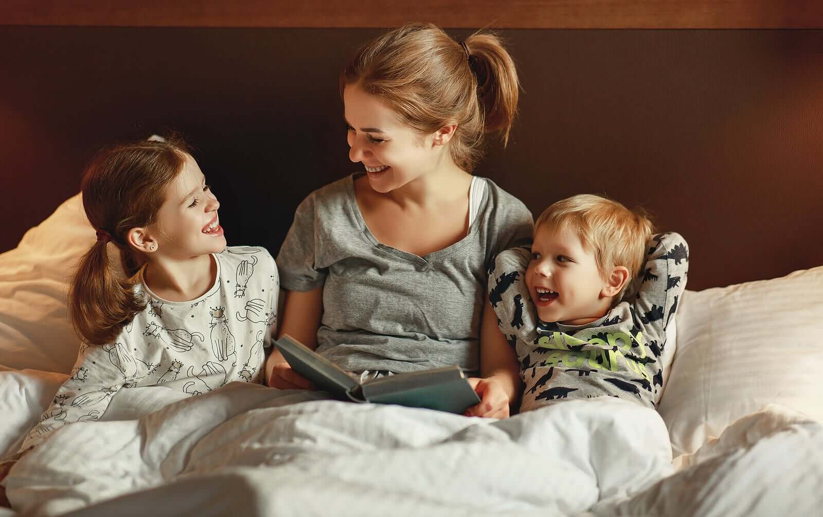 A mother reading a bedtime story to her children.