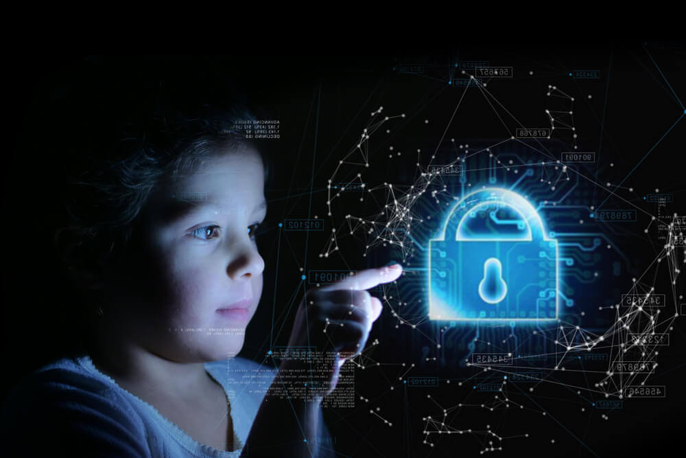 A child pointing to a lock on a transparent screen.