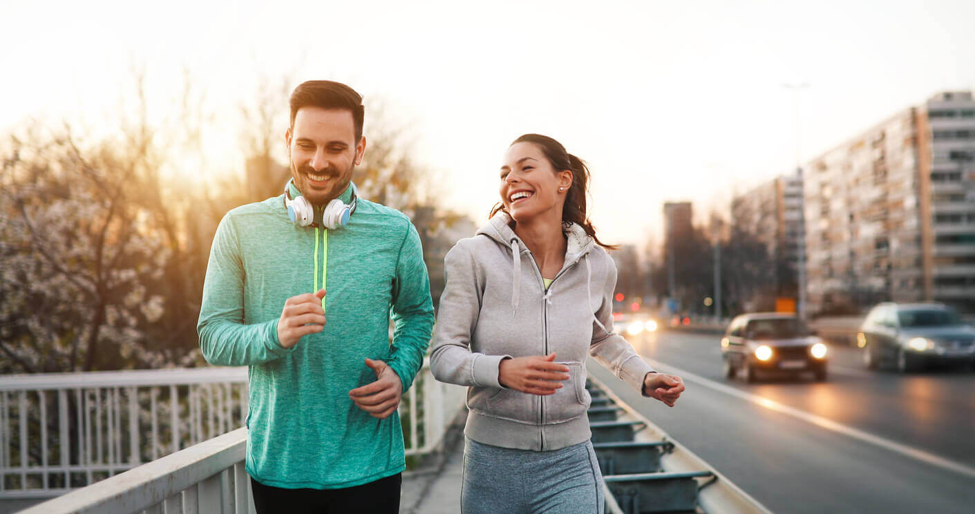 A couple running in the evening.