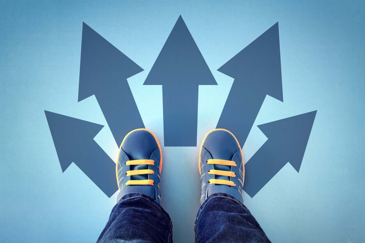 A child standing on arrows pointing in different directions.
