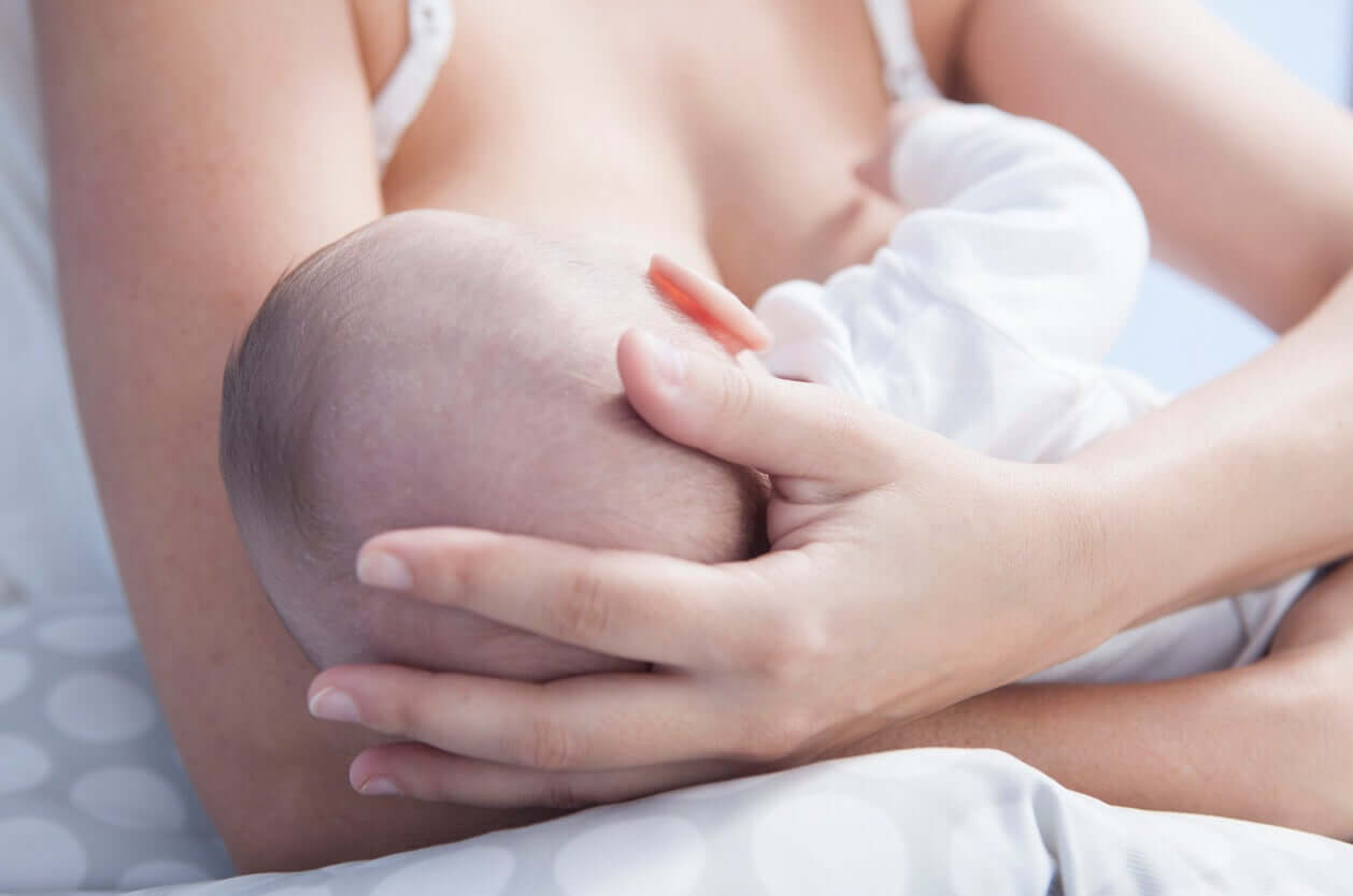 A newborn breastfeeding.