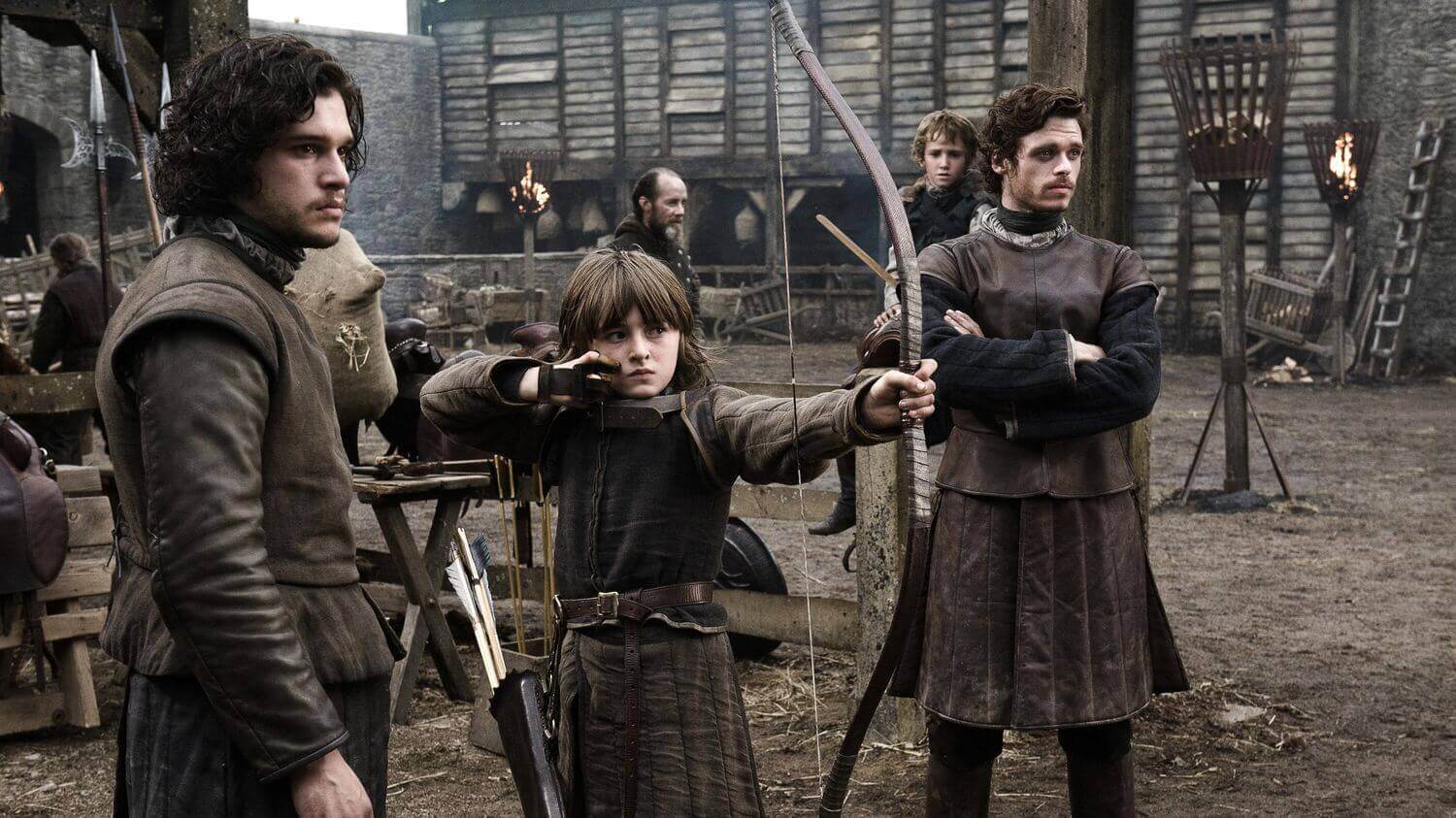 A child shooting an arrow in a scene from Game of Thrones.
