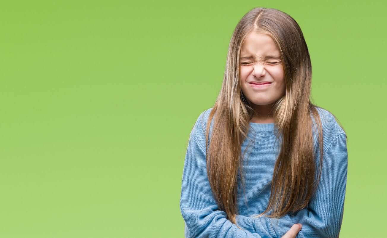A preteen girl with a belly ache.