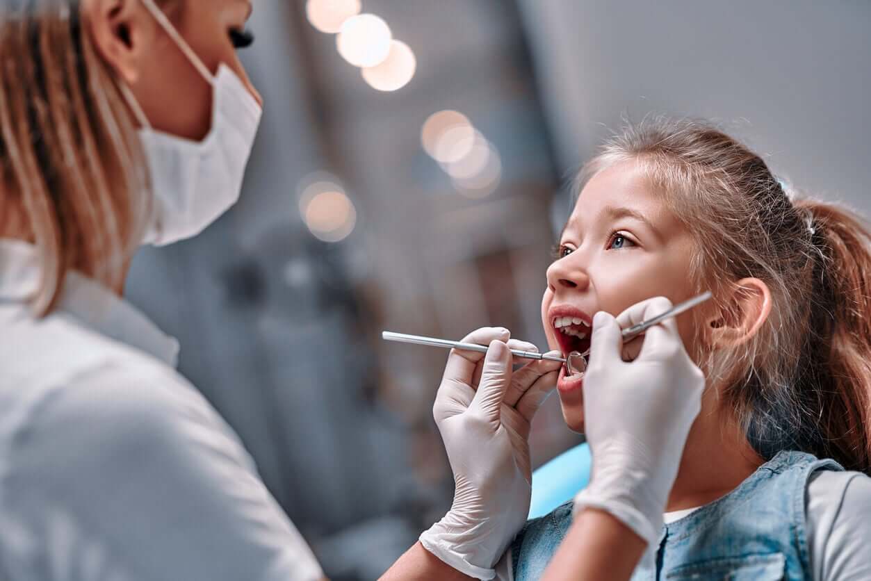 A young girl at the dentist.