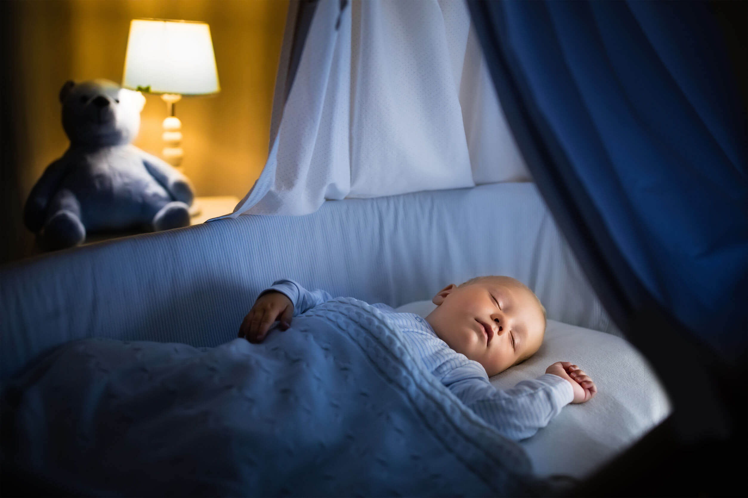 A baby boy sleeping peacefully.