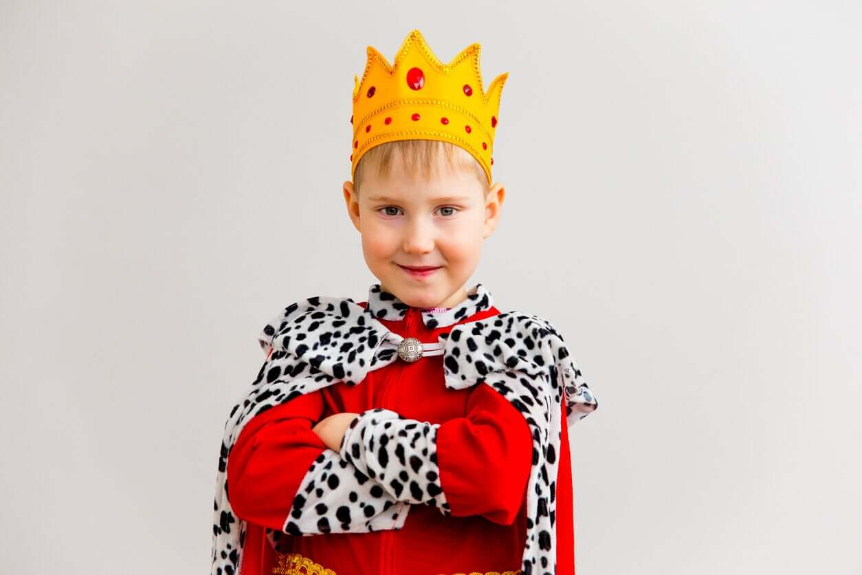 A boy dressed as a king.