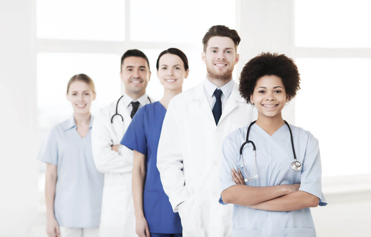 5 doctors standing in a row.