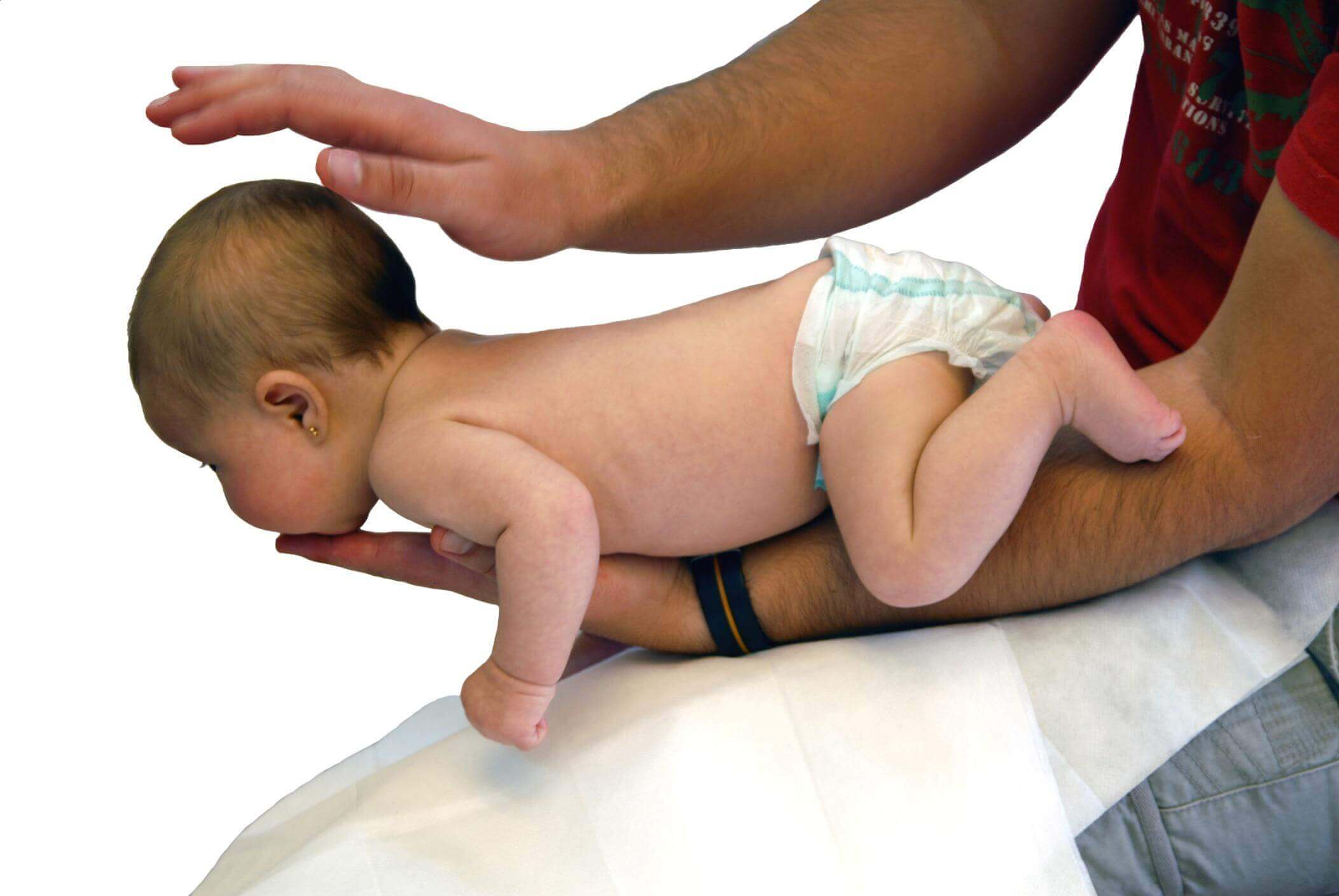 A man saving a choking baby.