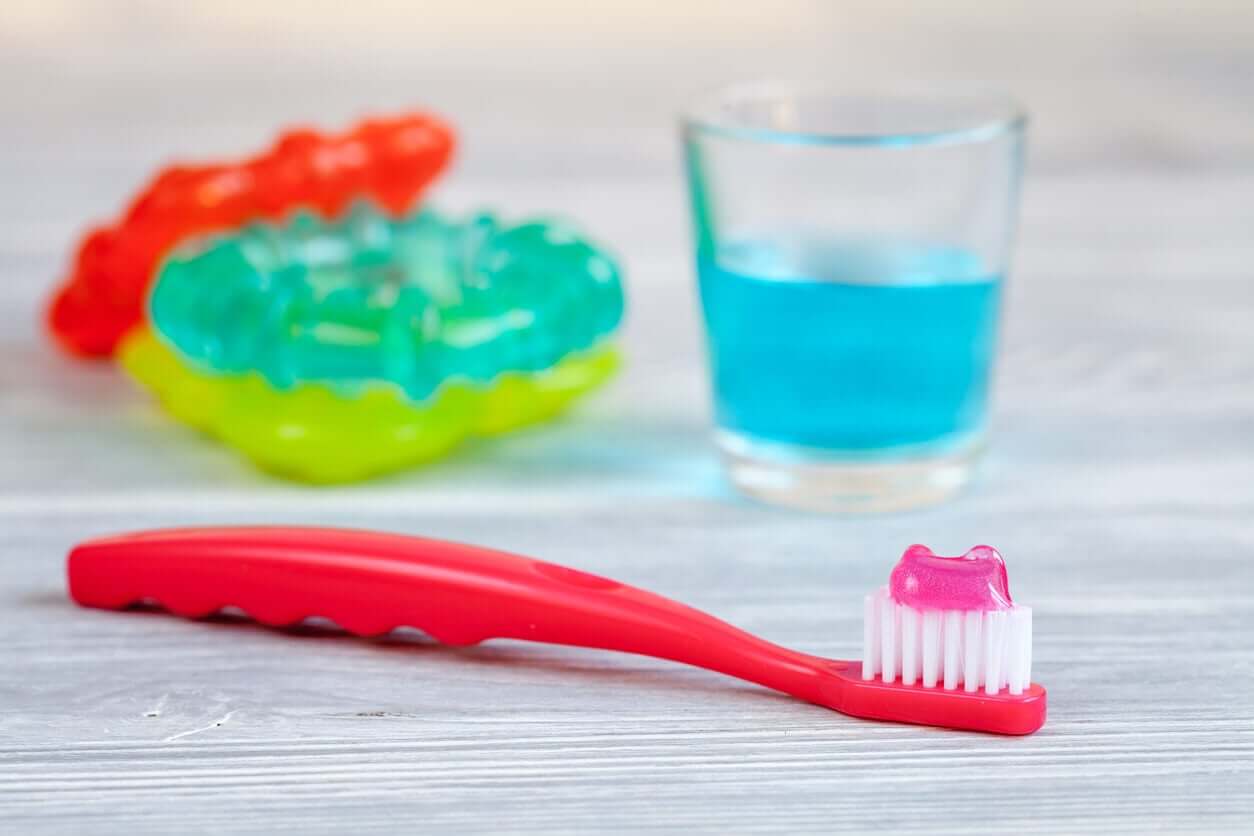 Baby teethers, mouthwash, and a children's toothbrush with toothpaste.