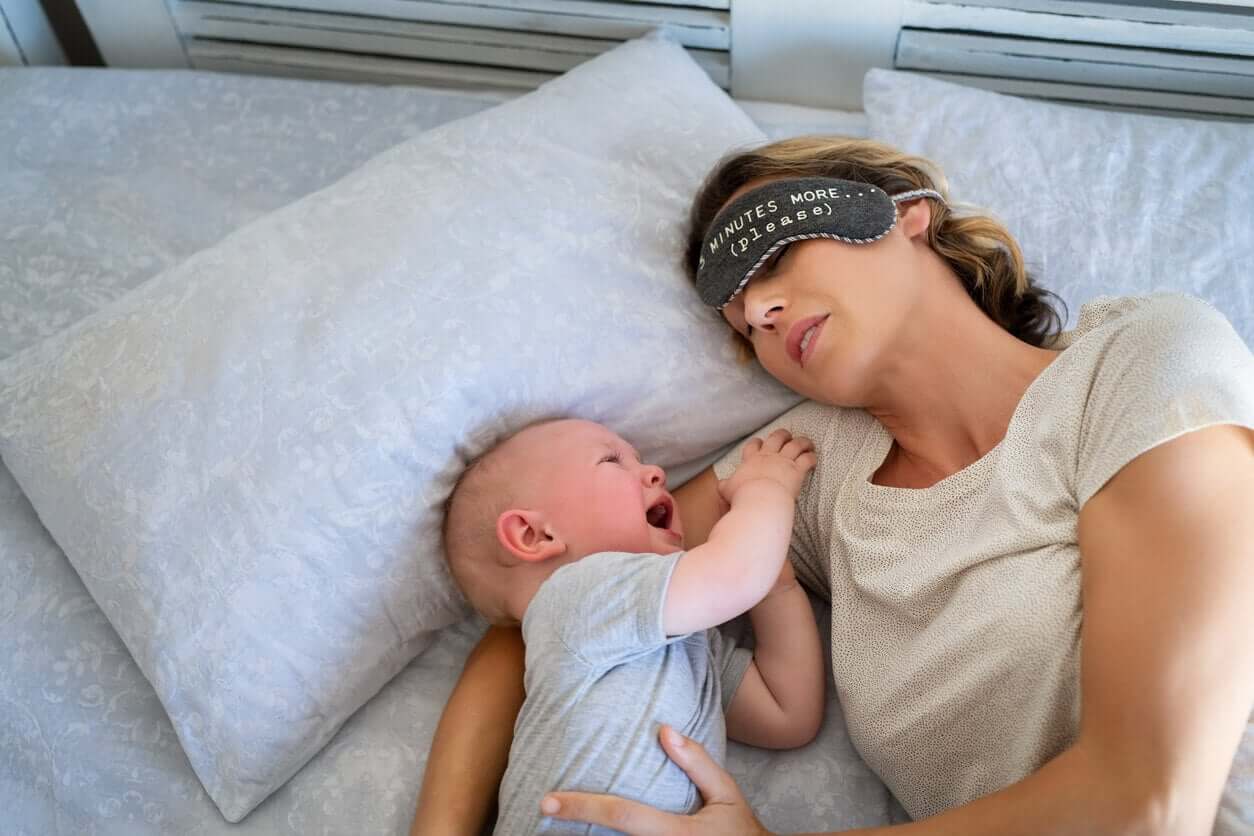 A baby crying while his mother tries to get him to sleep.