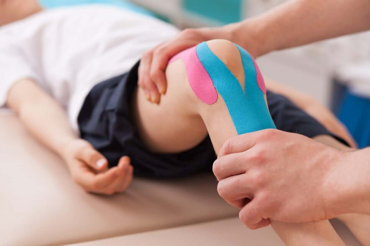 A child undergoing physical therapy for his knee.