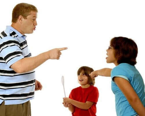 Parents blaming one another for their child's misbehavior.