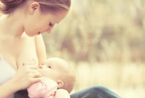 A woman breastfeeding her baby.