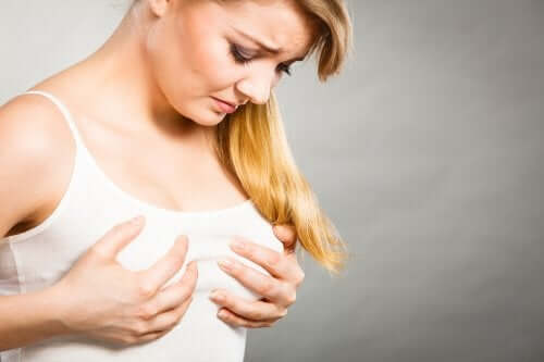 A woman with sore breasts.