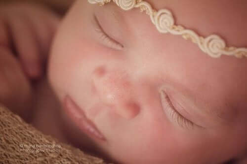 A newborn baby girl sleeping.