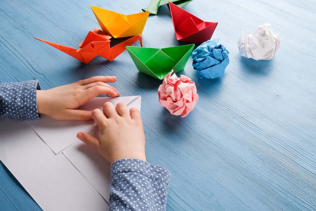 A child doing origami.