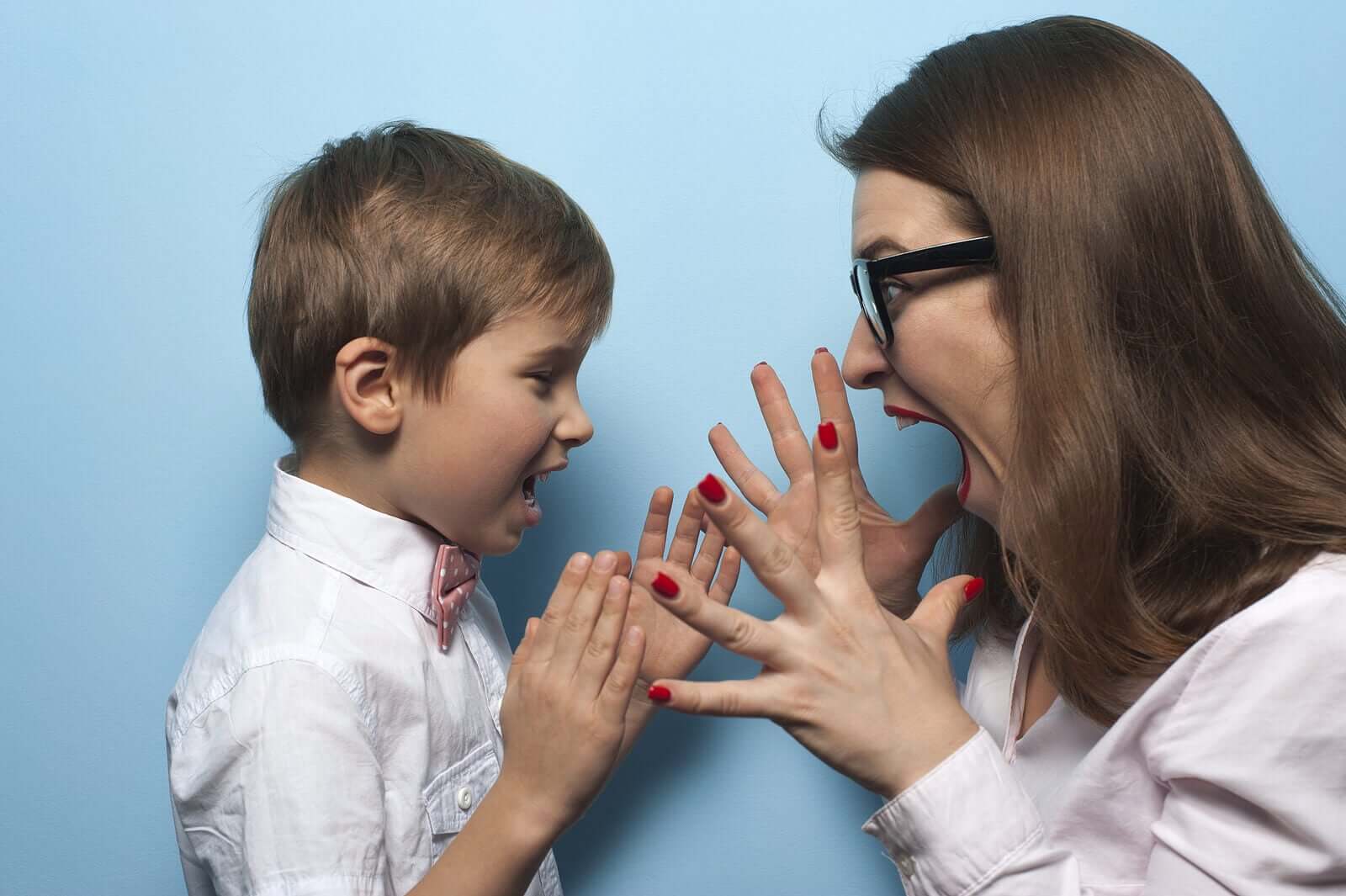 A child and her young son screaming at eachother.
