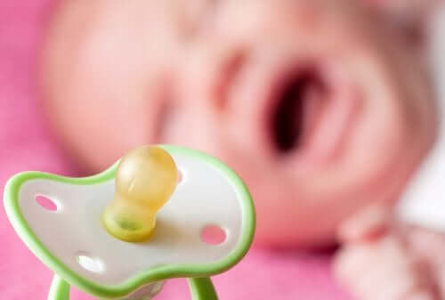 A baby crying for her pacifier.
