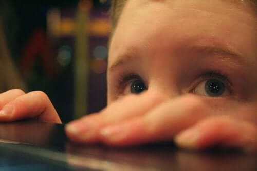 A young boy looking fearful.