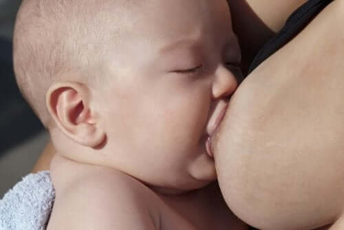 A baby breastfeeding.