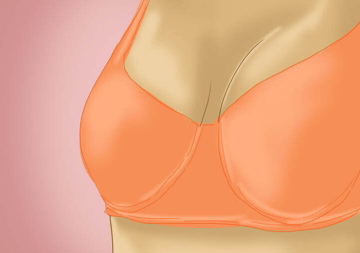 En teckning av fastare bröst i en orange bh.