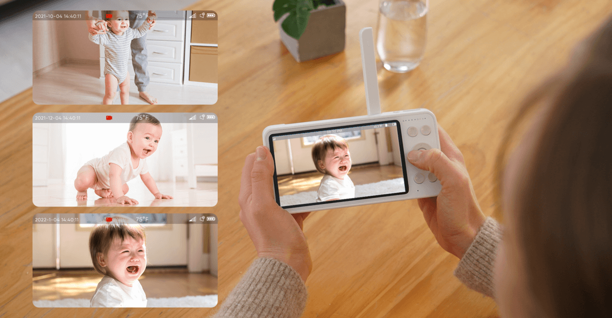 A mother observing her baby through a bonoch baby monitor.