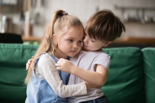 Two children sharing an empathetic hug.